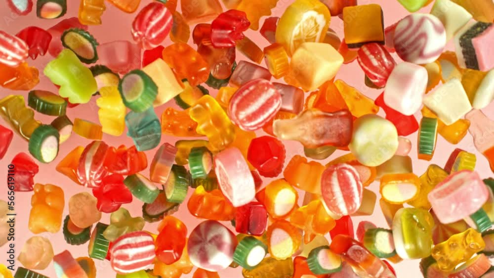 Super slow motion of flying candies up in the air. Camera in super fast motion. Filmed on high speed cinema camera, 1000 fps, placed on high speed cine bot. Super slow motion of flying candies up in the air. Camera in super fast motion. Filmed on high speed cinema camera, 1000 fps, placed on high speed cine bot.
