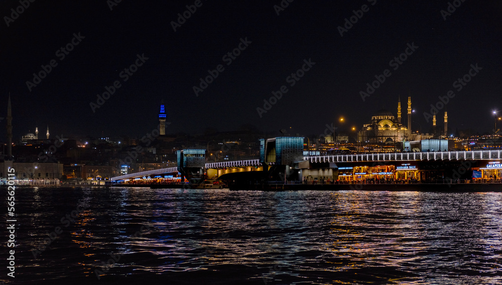 Night view of Galata bridge. Istanbul night landscapes. Mosques and estuary. Istanbul evenings. Golden Horn metro bridge.