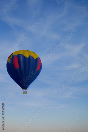 Blue air balloon flying in the clear blue sky. High quality photo - generative ai © unalcreative