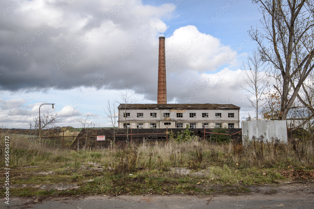 Old abandoned and run-down public-accessible factory .in a desolate landscape