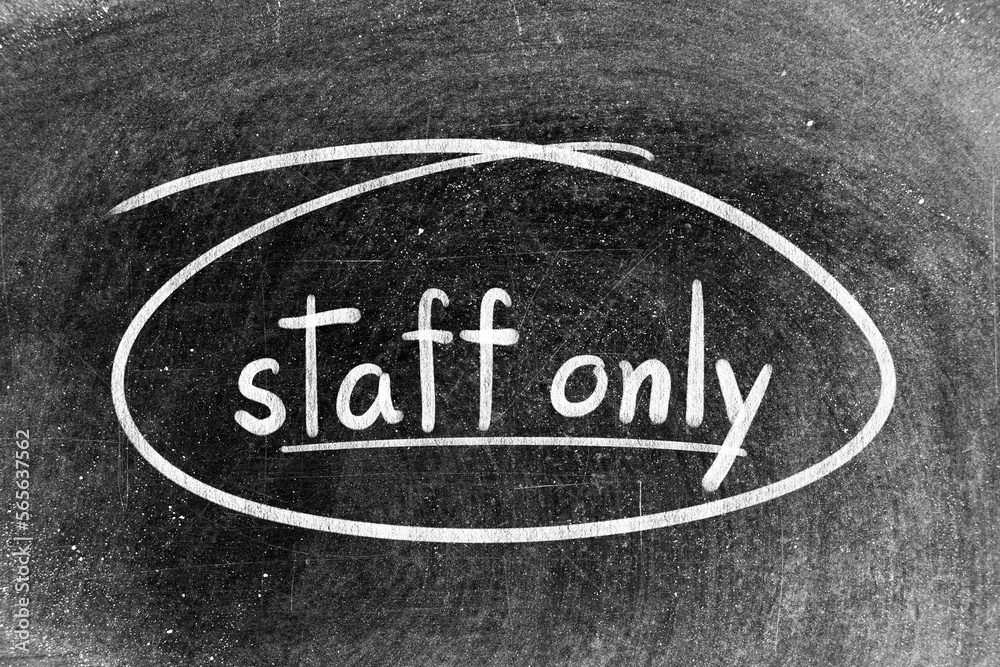 Fototapeta premium White chalk hand writing in word staff only and circle shape on blackboard background