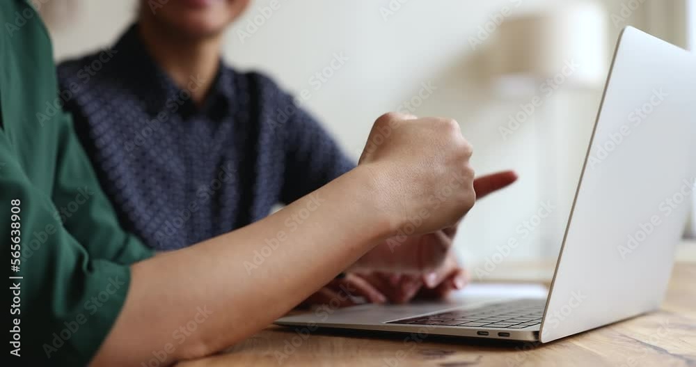 Arms of office female colleagues talking at laptop computer, speaking, listening, making hand gestured at pc display, smiling, discussing project, meeting at business workplace. Cropped shot Arms of office female colleagues talking at laptop computer, speaking, listening, making hand gestured at pc display, smiling, discussing project, meeting at business workplace. Cropped shot
