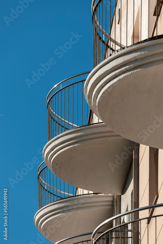 Rounded balconies of a building and blue sky, 