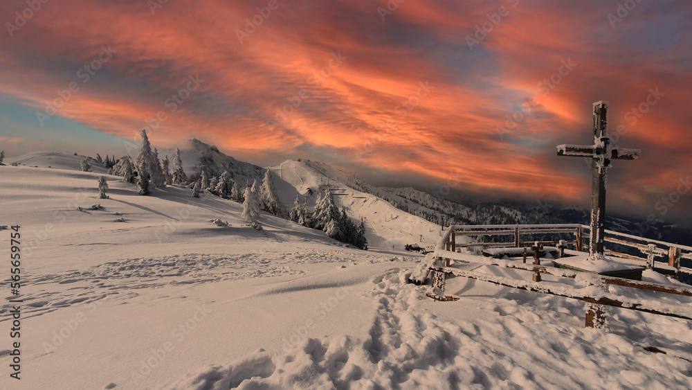 The snowy summit of Wagrain in the sunset