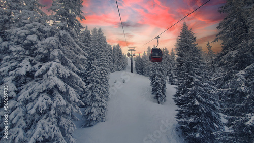 Ski lift in the sunset with snow in the Alps