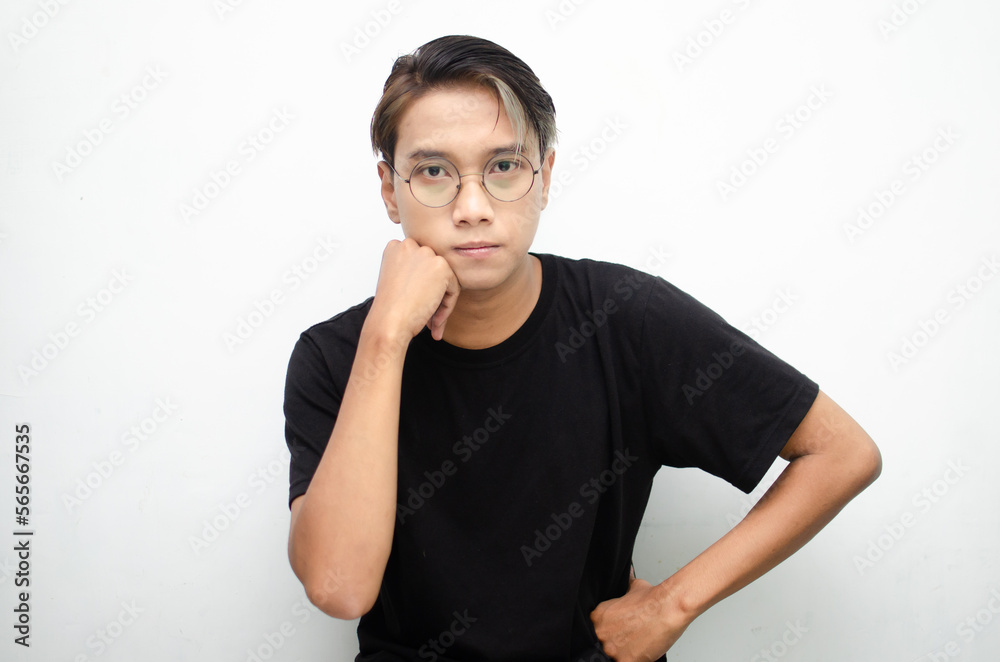 Thoughtful asian man in peek a boo hair hinking and wondering with hand touching skin as thinking gesture isolated over white background Thoughtful asian man in peek a boo hair hinking and wondering with hand touching skin as thinking gesture isolated over white background