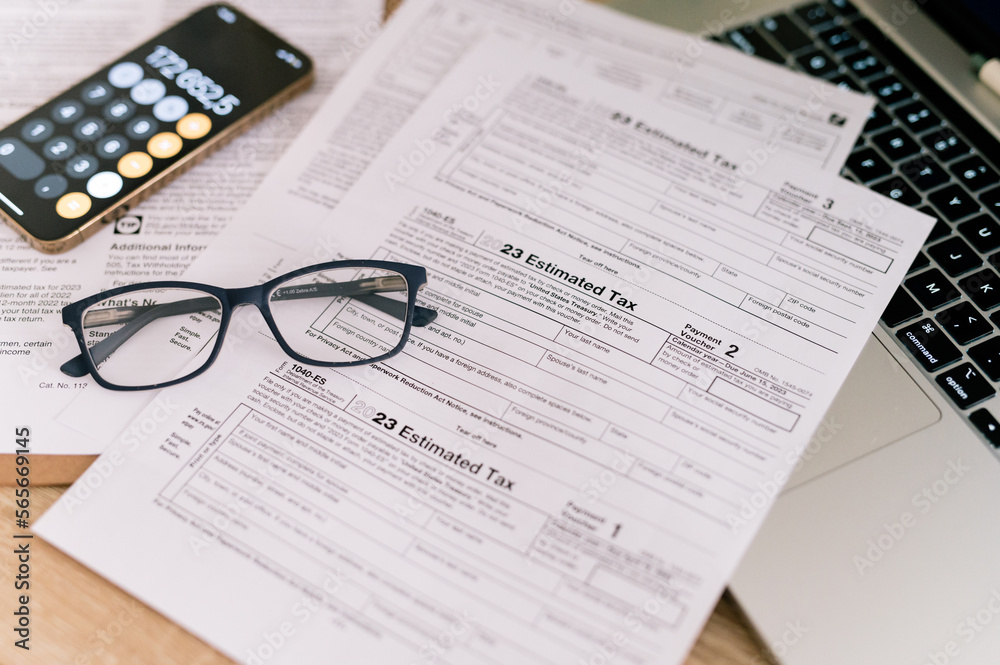 tax forms 2023 with glasses on the office table Stock Photo Adobe Stock
