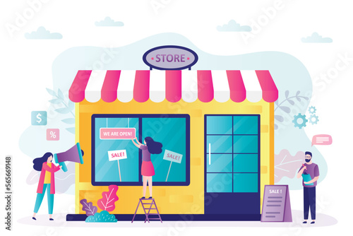 Store building, supermarket showcase. Group of marketing specialists starts a promotional action. Announcement of sale, discounts. Advertising posters in window and near entrance to store.