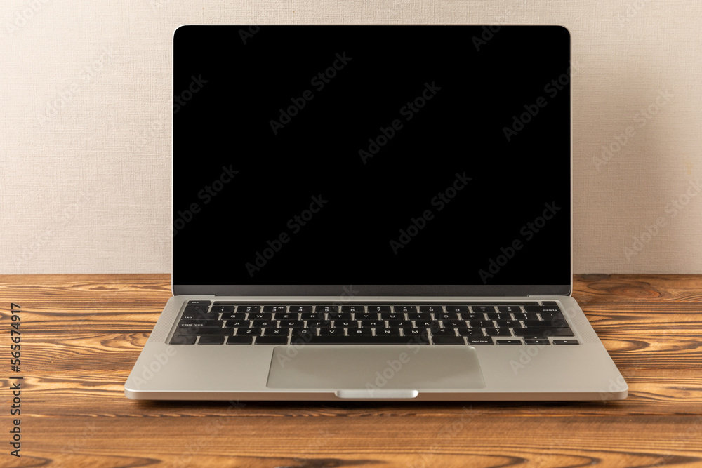 Laptop with a blank black screen on a white background. Laptop on the office table. MOCAP. Technology concept and design Laptop with a blank black screen on a white background. Laptop on the office table. MOCAP. Technology concept and design