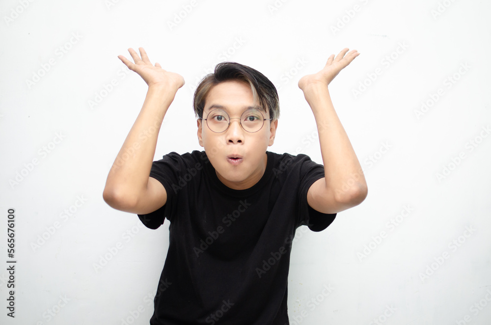 A cheerful, ecstatic Asian man wears a casual black t-shirt, pointing to copy space and presenting and displaying goods. billboard model advertisment concept. A man with a wow expression displaying so A cheerful, ecstatic Asian man wears a casual black t-shirt, pointing to copy space and presenting and displaying goods. billboard model advertisment concept. A man with a wow expression displaying so