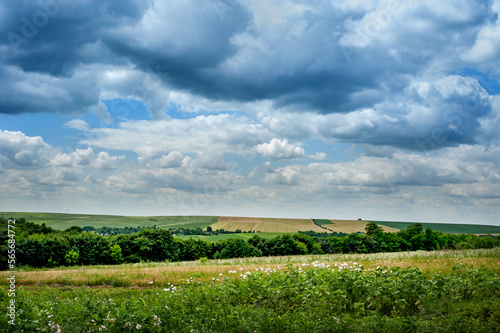 Landscape of the countryside in summer, fields, land and fantastic sky