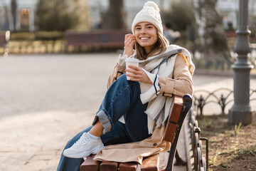 stylish woman walking in winter street
