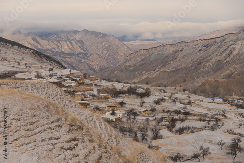 The aul is located on a mountainside in Dagestan and is covered with snow.