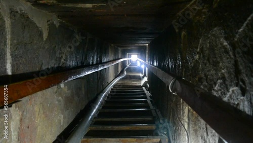 Narrow passge leading to the burial chamber inside the red north pyramid of Dahshur of king Sneferu, named for the rusty reddish hue of its red limestone stones, also called the bat pyramid photo