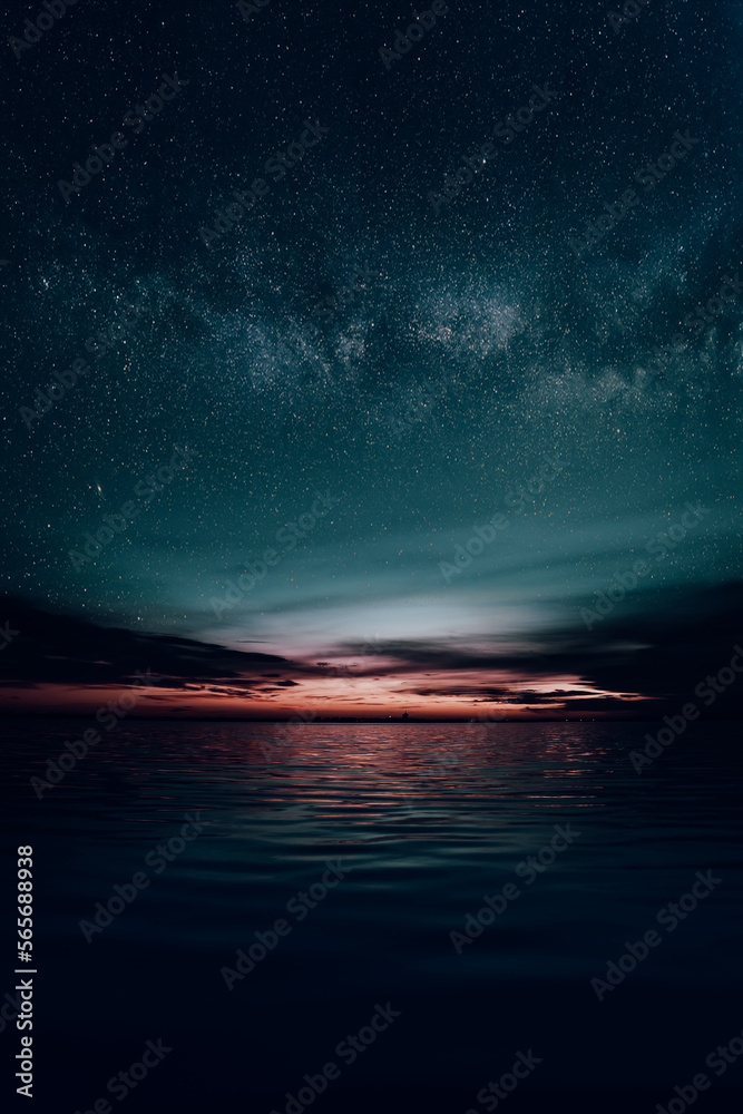 Ciel étoilé au bord d'un lac