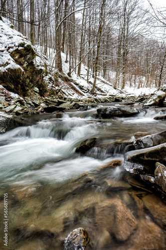 Mountain stream in winter scenery. Prowcza Stream, Bieszczady National Park, Carpathian Mountains, Poland. One of the most popular travel destinations in Poland.