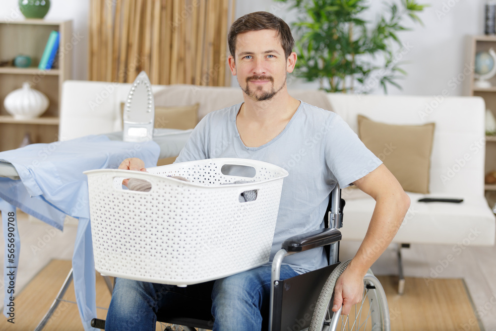 young disabled man in wheelchair using basket young disabled man in wheelchair using basket