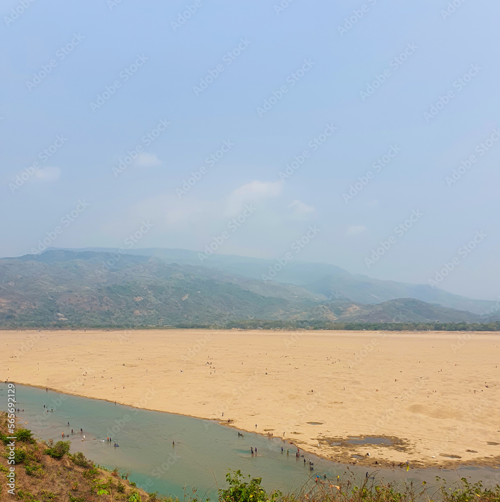 Jadukata River - a beautiful river near the India border during the winter season with the hills of Meghalaya on the back in Sylhet, Bangladesh. Jadukata River - a beautiful river near the India border during the winter season with the hills of Meghalaya on the back in Sylhet, Bangladesh.