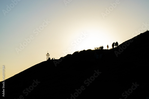 silhouette of a person on a mountain top