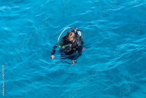 Egypt - diver with scuba swimming in Red sea