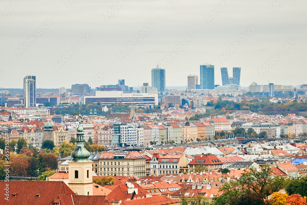 Cityscape of Prague in autumn with traditional czech architecture aand modern Dancing House.