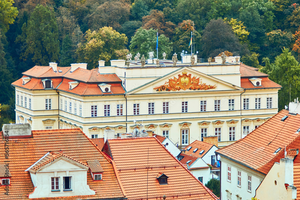 High angle view of Embassy of Germany by autumn trees in Prague, Czech Republic.