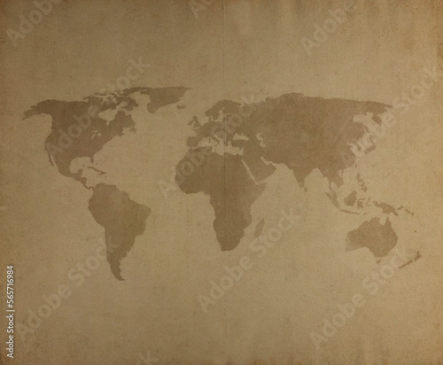 World map on a weathered and aged paper. High resolution full frame textured paper background. Old looking  vintage world map.