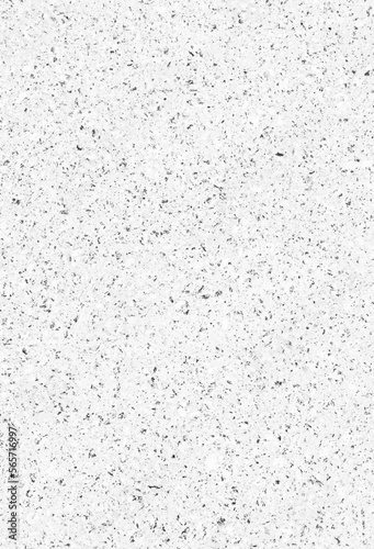 Close-up of a white wall or flooring made of concrete or cement and small stones. Abstract full frame textured background in black and white. Copy space.