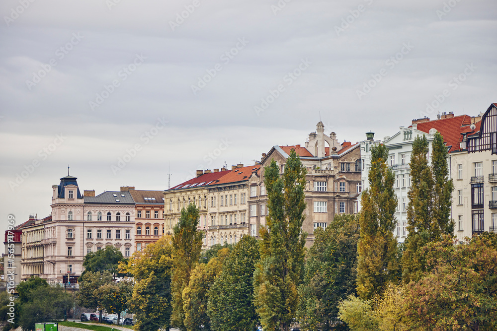 Prague buildings through the trees in autumn.