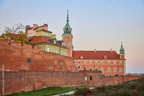 Red wall of Royal Castle in Warsaw at evening, Poland.
