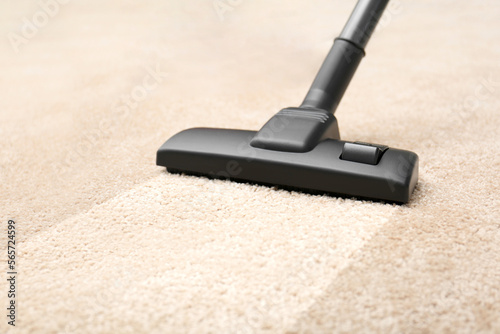 Vacuuming carpet. Clean area after using device, closeup