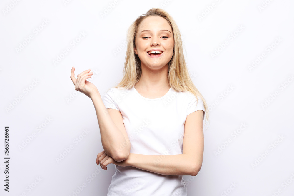 charming young woman with long blond hair dressed in a white t-shirt and jeans charming young woman with long blond hair dressed in a white t-shirt and jeans