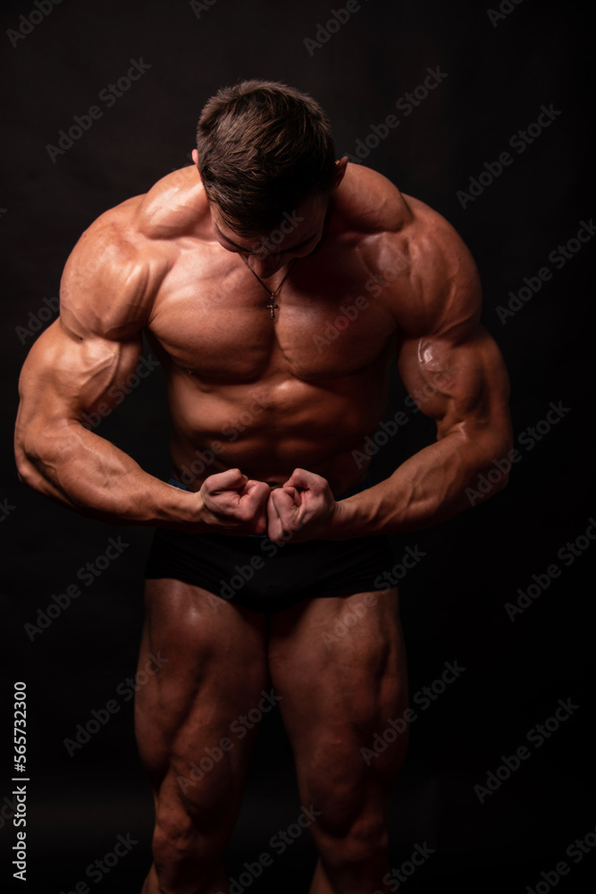 A Muscled Man Flexes his Impressive Physique A Muscled Man Flexes his Impressive Physique