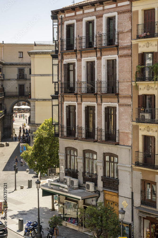 Facades of central old buildings next to Plaza Mayor in Madrid