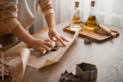 Mom and daughter are making cookies on the kitchen table 4304.