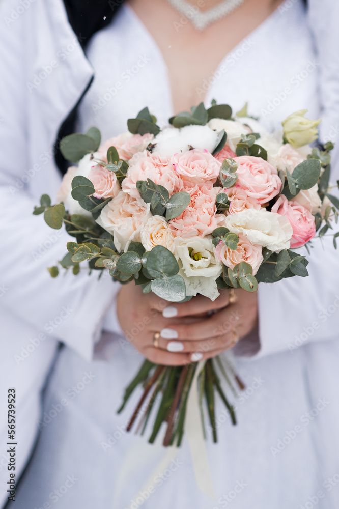 A large photo of a wedding bouquet in the hands of the bride 4370. A large photo of a wedding bouquet in the hands of the bride 4370.