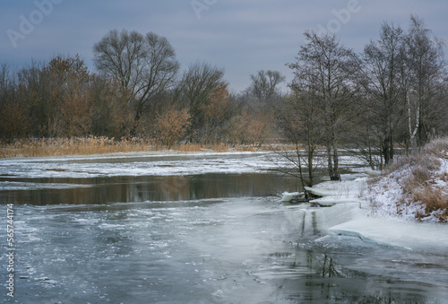 The end of winter  the river opened up from the ice. Winter landscape on a small river