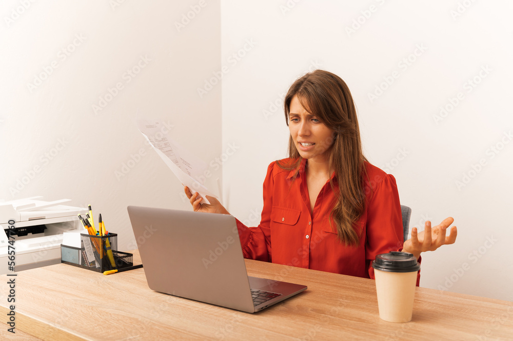 Young upset blonde gesturing woman has a bad day at work in her office. Young upset blonde gesturing woman has a bad day at work in her office.