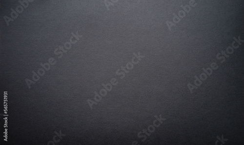 The background is black. Photo of the texture of black paper.A blank blank of dark color.
