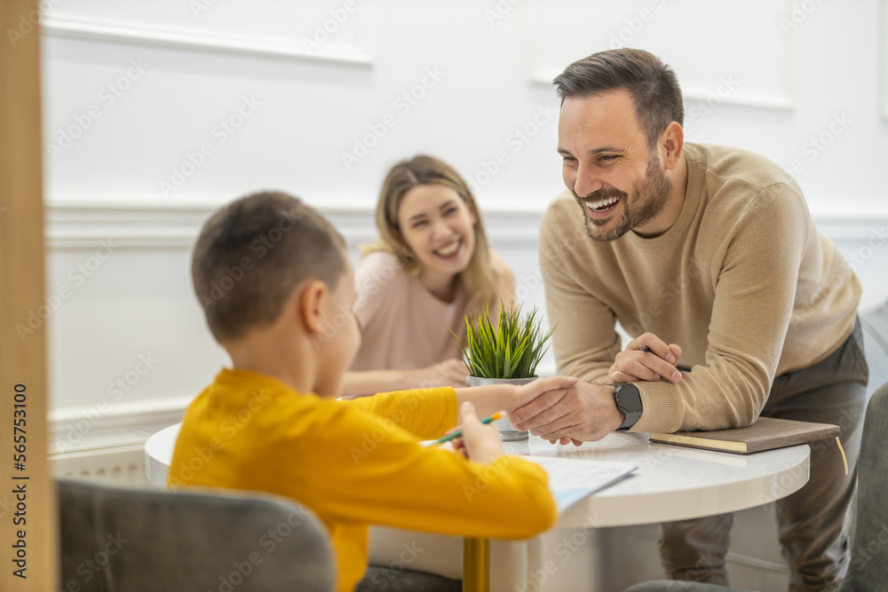 Little boy watching lesson online and studying from home