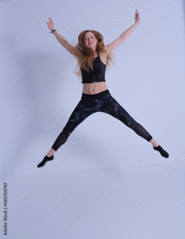 Obraz premium young woman with long hair jumping happy
