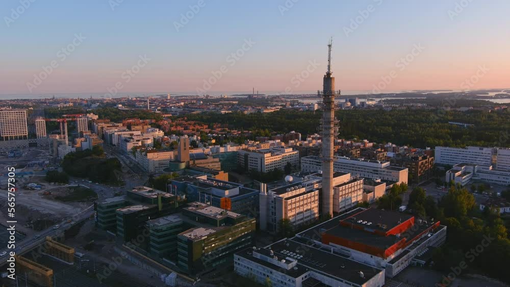 Helsinki.Finland-August 30.2021: Idyllic aerial view of the Tv tower in Helsinki Finland. Beautiful cityscape. Amazing architecture. Sunset. Drone slowly moving backwards and upwards. Helsinki.Finland-August 30.2021: Idyllic aerial view of the Tv tower in Helsinki Finland. Beautiful cityscape. Amazing architecture. Sunset. Drone slowly moving backwards and upwards.