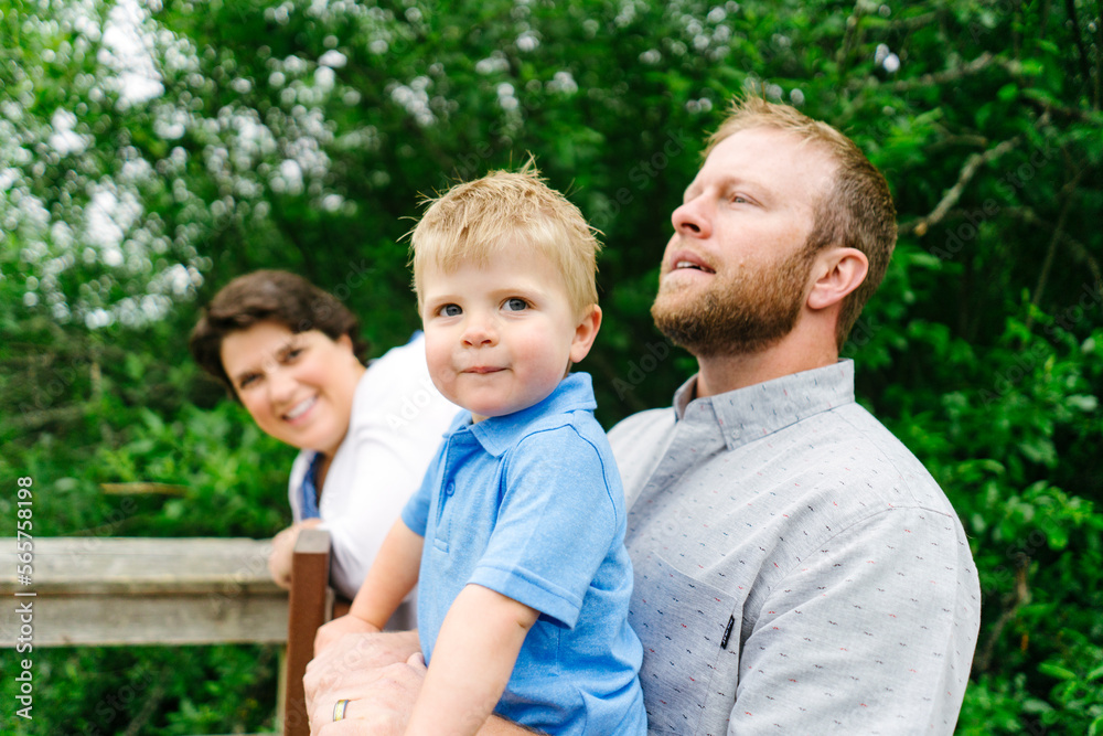 Straight on view of a young boy with his family Straight on view of a young boy with his family