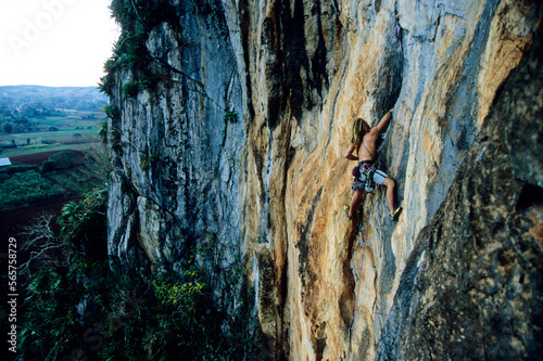 A rock climber climbs a steep limestone wall in the ViÃ¯Â¿Â½ales Valley, Cuba