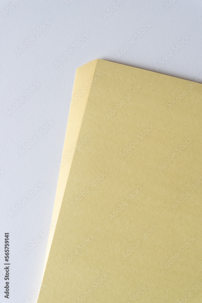 pile of pale yellow construction paper pile of pale yellow construction paper