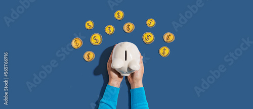 Person holding piggy bank with hand drawn coins