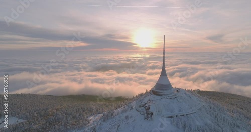 Jested tower mountain hill with snow mist and fog at golden hour