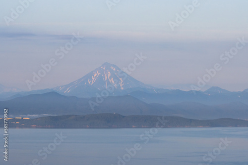 View of Avacha Bay and Vilyuchinsky Volcano  Vilyuchinskaya Sopka . Natural attractions of the Kamchatka Peninsula. Travel and tourism in Siberia and the Russian Far East. Beautiful natural background