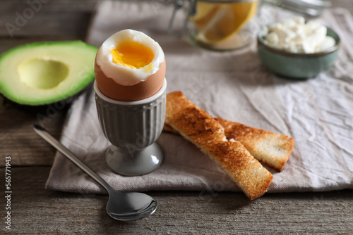 Quadro em tela Soft boiled egg served for breakfast on wooden table