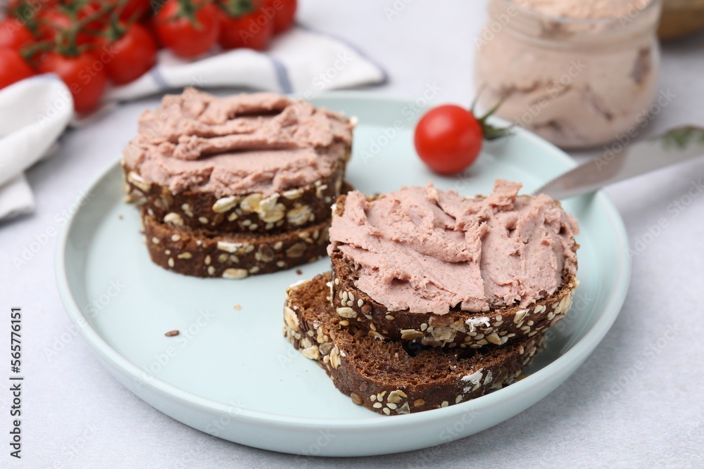 Delicious liverwurst sandwiches served on white table, closeup